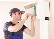 HVAC contractor installing air conditioner