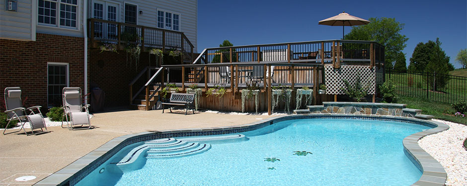 backyard pool with large deck patio