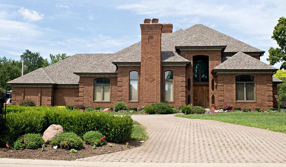 brick luxury home with new roof