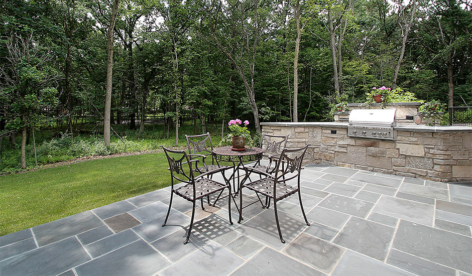 patio with custom BBQ and granite tiles