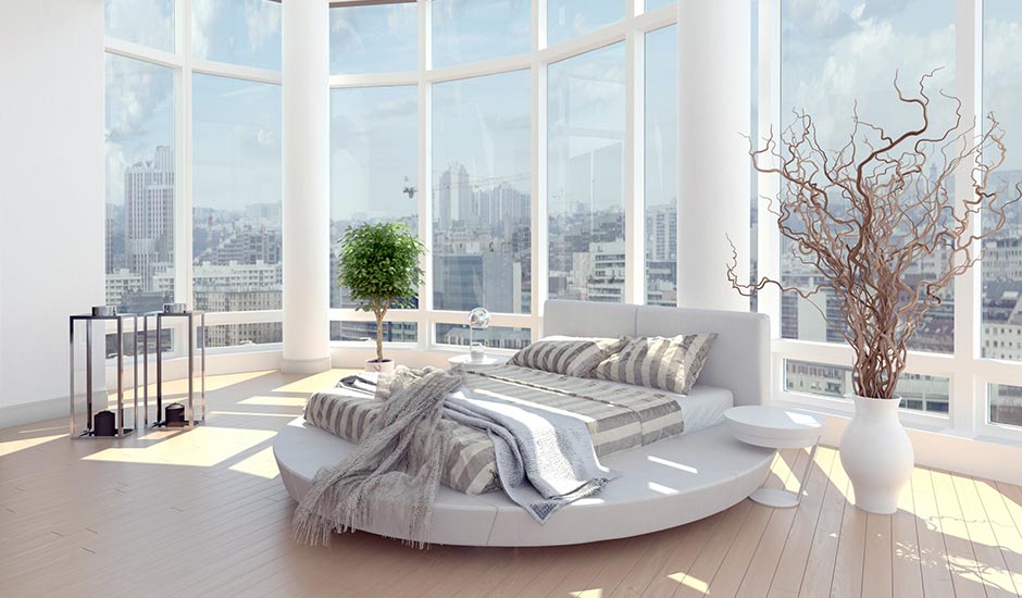 modern bedroom with circle bed and city view