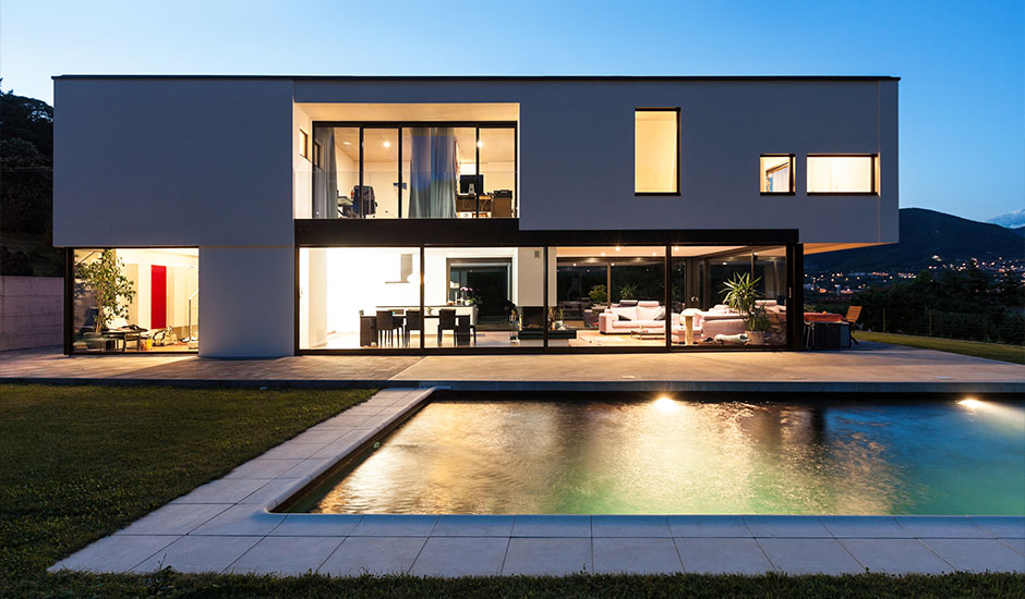 modern home and pool at dusk