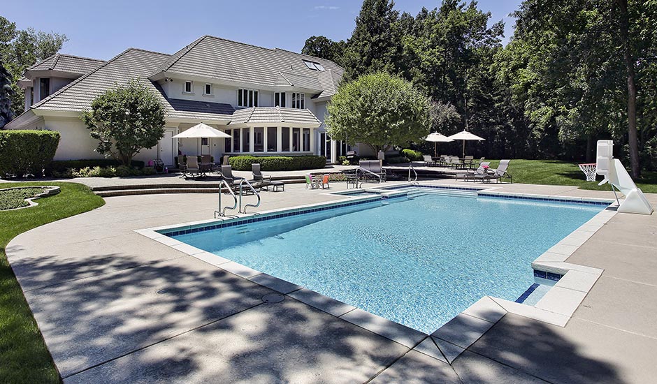 luxury backyard pool with basketball hoop