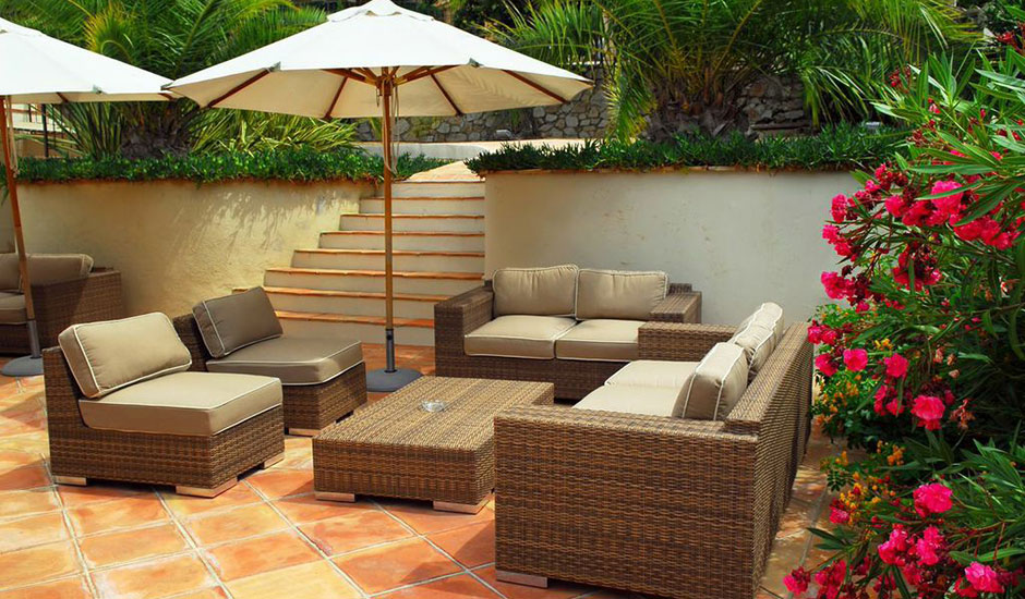 tiled patio with backyard furniture